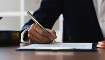Man-signing-documents.jpg